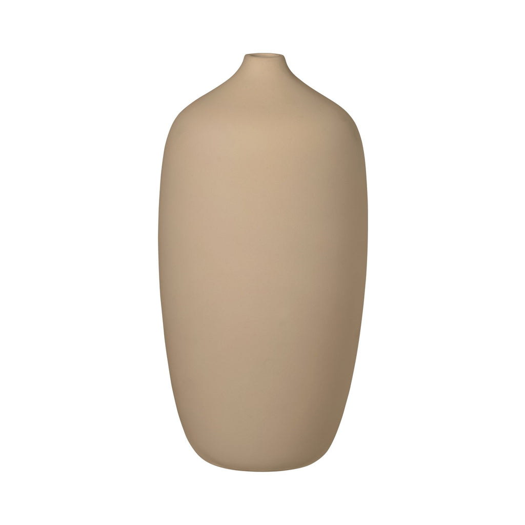 A beige, cylindrical vase with a smooth finish.
